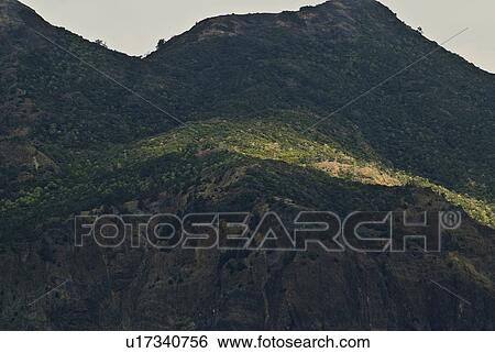 Stock Photograph - Sunlight on Mountain. Fotosearch