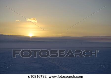 Stock Image - Sunrise Over Snow Fields. Fotosearch