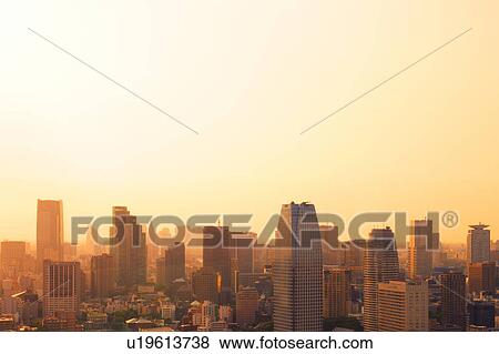 Stock Photo - Sunset Over Tall Buildings. Fotosearch