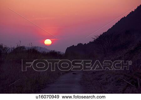 Stock Photo - Sunset Over the Mountains. Fotosearch