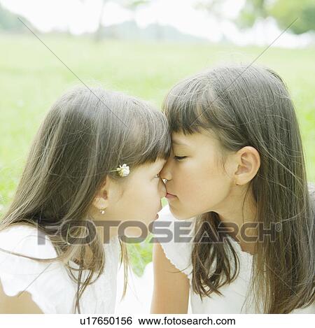 Two Girls Looking at Each Other With Faces Touching View Large Photo Image Stock Photograph - Two Girls Looking at Each Other With Faces Touching. Fotosearch