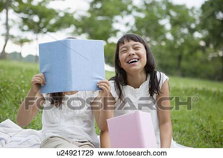 Stock Photo - Two Girls Reading Books. Fotosearch
