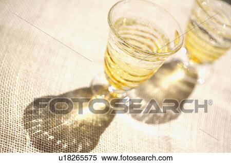 Two glasses and shadows View Large Photo Image Stock Photography - Two glasses and shadows. Fotosearch