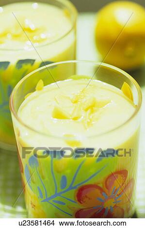 Picture - Two glasses of fruit juice. Fotosearch