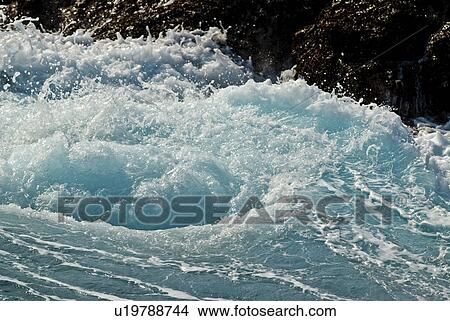 Picture - Water Splashing Against Rocks. Fotosearch