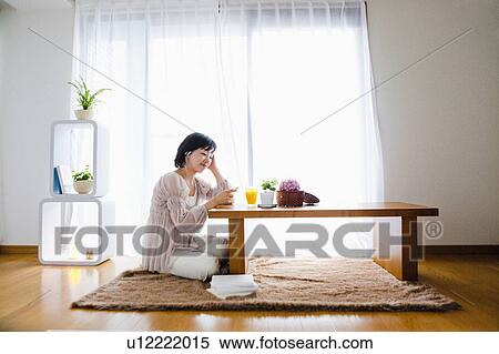 Woman Listening to Music in Living Room View Large Photo Image Stock Photography - Woman Listening to Music in Living Room. Fotosearch