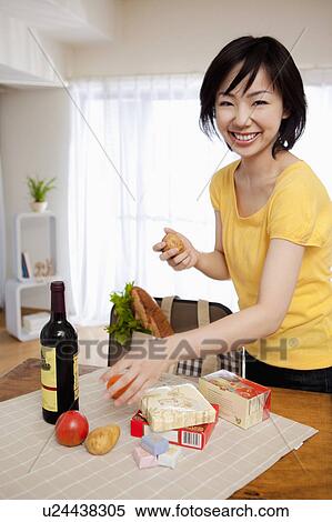 Woman Sorting Out Grocery Shopping View Large Photo Image Stock Photography - Woman Sorting Out Grocery Shopping. Fotosearch