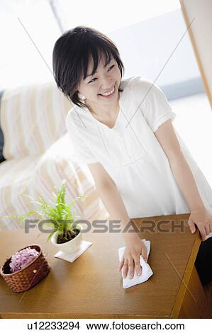 Woman Wiping Chest of Drawers View Large Photo Image Picture - Woman Wiping Chest of Drawers. Fotosearch