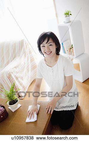 Woman Wiping Chest of Drawers View Large Photo Image Stock Photo - Woman Wiping Chest of Drawers. Fotosearch