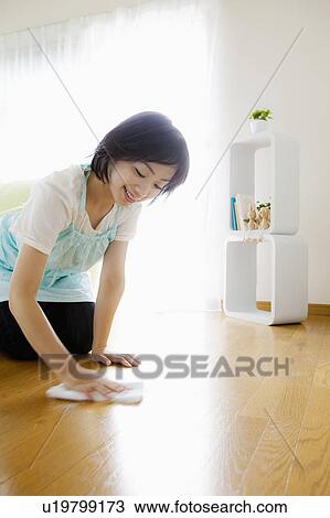 Stock Image - Woman Wiping Floor. Fotosearch