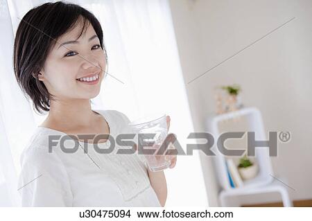 Picture - Woman With a Glass of Water. Fotosearch