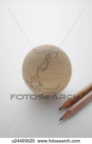 Stock Image - Wooden Globe and Two Pencils. Fotosearch