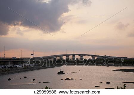 Yone elevated bridge at dusk, Okinawa Prefecture, Japan View Large Photo Image Stock Photograph - Yone elevated bridge at dusk, Okinawa Prefecture, Japan. Fotosearch