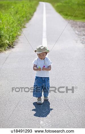 Young Boy Walking on Road View Large Photo Image Stock Image - Young Boy Walking on Road. Fotosearch