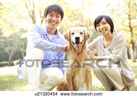 Young Couple and a Domestic Dog View Large Photo Image Picture - Young Couple and a Domestic Dog. Fotosearch
