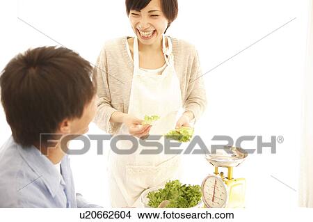 Young Couple Cooking Together View Large Photo Image Picture - Young Couple Cooking Together. Fotosearch