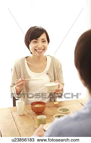 Stock Image - Young Couple Having Breakfast. Fotosearch