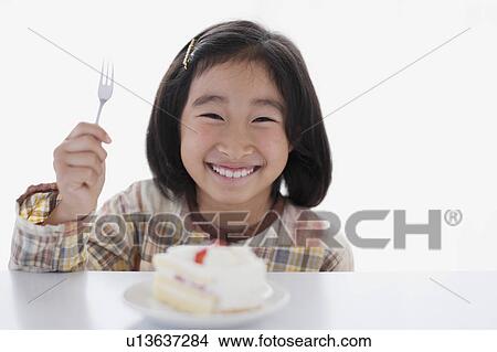 Young Girl Eating Cake View Large Photo Image Picture - Young Girl Eating Cake. Fotosearch