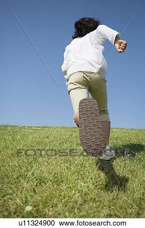 Young Girl Running in Field View Large Photo Image Stock Image - Young Girl Running in Field. Fotosearch