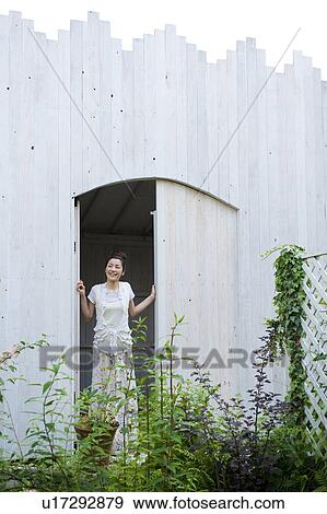 Young Woman at Door View Large Photo Image Stock Photo - Young Woman at Door. Fotosearch