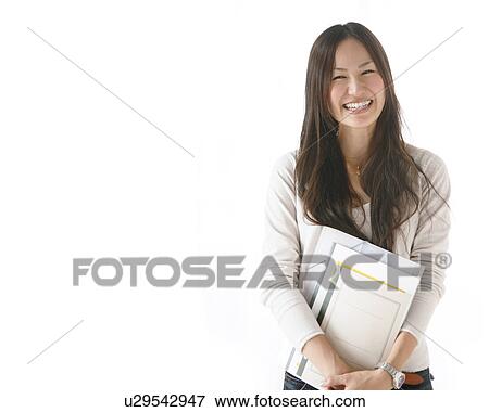 Young Woman Holding Notebooks View Large Photo Image Stock Photo - Young Woman Holding Notebooks. Fotosearch