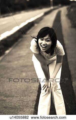 Young woman looking at camera View Large Photo Image Stock Image - Young woman looking at camera. Fotosearch