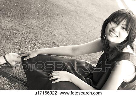 Young woman looking at camera View Large Photo Image Stock Image - Young woman looking at camera. Fotosearch