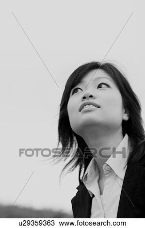 Young woman looking away View Large Photo Image Stock Image - Young woman looking away. Fotosearch