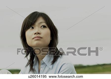 Young woman looking away View Large Photo Image Stock Photography - Young woman looking away. Fotosearch
