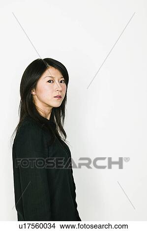 Picture - Young Woman Looking Serious. Fotosearch