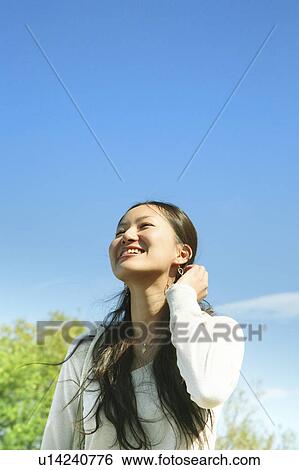 Young Woman Looking Up the Sky View Large Photo Image Stock Photograph - Young Woman Looking Up the Sky. Fotosearch