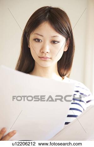 Stock Image - Young Woman Reading. Fotosearch