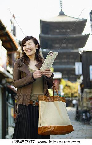 Young Woman Sightseeing in City View Large Photo Image Stock Photo - Young Woman Sightseeing in City. Fotosearch
