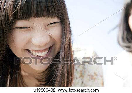 Stock Image - Young Woman Smiling. Fotosearch