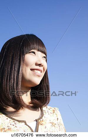 Stock Photograph - Young Woman Smiling. Fotosearch