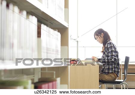 Young woman studying in a library, Japan View Large Photo Image Stock Photography - Young woman studying in a library, Japan. Fotosearch