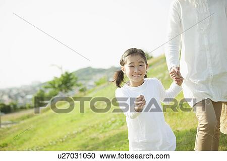 Young Woman Walking in Field With her Mother View Large Photo Image Stock Image - Young Woman Walking in Field With her Mother. Fotosearch