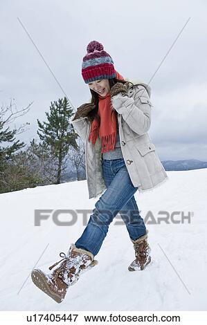 Young Woman Walking in Snow View Large Photo Image Stock Photo - Young Woman Walking in Snow. Fotosearch