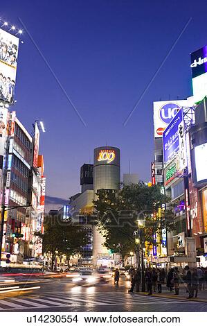 Picture - Zebra crossing in front of Shibuya train station, Shibuya Ward, Tokyo Prefecture, Honshu, Japan. Fotosearch