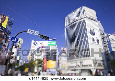 Stock Photography - Zebra crossing in front of Shibuya train station, Shibuya Ward, Tokyo Prefecture, Honshu, Japan. Fotosearch