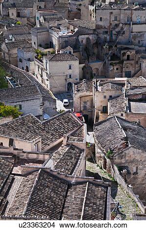 Aerial detail of ancient town of Matera with tufa houses, sunny spring afternoon, Puglia, Southern Italy, View Large Photo Image Picture - Aerial detail of ancient town of Matera with tufa houses, sunny spring afternoon, Puglia, Southern Italy,. Fotosearch