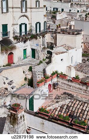 Stock Photo - Aerial detail of ancient town of Matera with tufa houses, sunny spring afternoon, Puglia, Southern Italy,. Fotosearch
