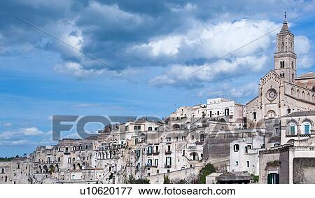Aerial view of ancient town of Matera with tufa houses, and Duomo on hill, sunny spring afternoon with blue sky, Puglia, Southern Italy, View Large Photo Image Stock Photo - Aerial view of ancient town of Matera with tufa houses, and Duomo on hill, sunny spring afternoon with blue sky, Puglia, Southern Italy,. Fotosearch