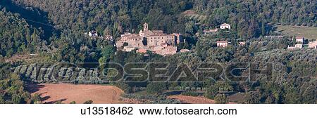 Aerial view of medieval town of Doglio nestled amongst woods on hillside, olive groves, and ploughed fields, Umbria, Italy View Large Photo Image Stock Image - Aerial view of medieval town of Doglio nestled amongst woods on hillside, olive groves, and ploughed fields, Umbria, Italy. Fotosearch
