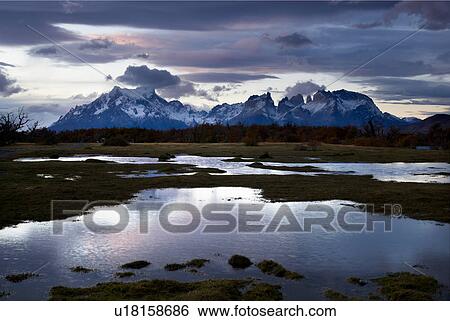 Cerro Paine Grande, Los Torres, Los Cuernos, sunset, with reflection in Rio Serrano river, Torres del Paine, Southern Chile, Patagonia View Large Photo Image Stock Photograph - Cerro Paine Grande, Los Torres, Los Cuernos, sunset, with reflection in Rio Serrano river, Torres del Paine, Southern Chile, Patagonia. Fotosearch