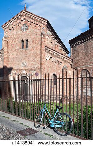 Church of Santo Stefano, complex of seven churches, showing facade of SS. Vitale e Agricola from street, in late afternoon summer sunshine, with old blue metal bicycle leaning against iron railing, Bologna, Italy View Large Photo Image Stock Image - Church of Santo Stefano, complex of seven churches, showing facade of SS. Vitale e Agricola from street, in late afternoon summer sunshine, with old blue metal bicycle leaning against iron railing, Bologna, Italy. Fotosearch