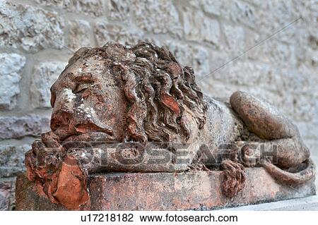 Close up frontal view of Renaissance statue of sleeping lion, church of Santa Chiara, Assisi, Umbria, Italy View Large Photo Image Stock Image - Close up frontal view of Renaissance statue of sleeping lion, church of Santa Chiara, Assisi, Umbria, Italy. Fotosearch