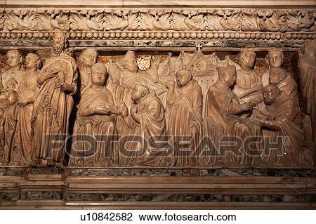 Stock Image - Close up view of ornate carved marble sarcophagus, in chapel of San Domenico, Bologna Italy. Fotosearch