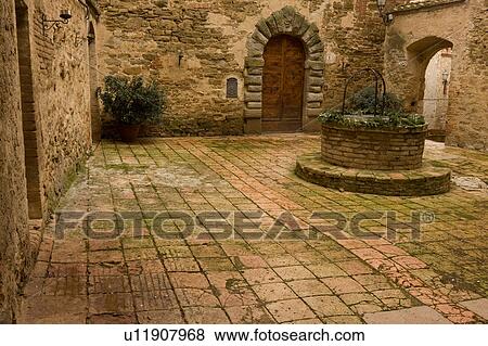 Stock Photo - Courtyard interior of Castello, Sant'Appollinare on overcast winter day, showing beauty of ancient brickwork and colours. Fotosearch
