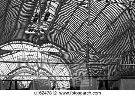 Covent Garden, Royal Opera House, Paul Hamlyn Hall, desaturated image: detail of wrought iron and glass ceiling with abstract effect of glass reflections View Large Photo Image Stock Image - Covent Garden, Royal Opera House, Paul Hamlyn Hall, desaturated image: detail of wrought iron and glass ceiling with abstract effect of glass reflections. Fotosearch